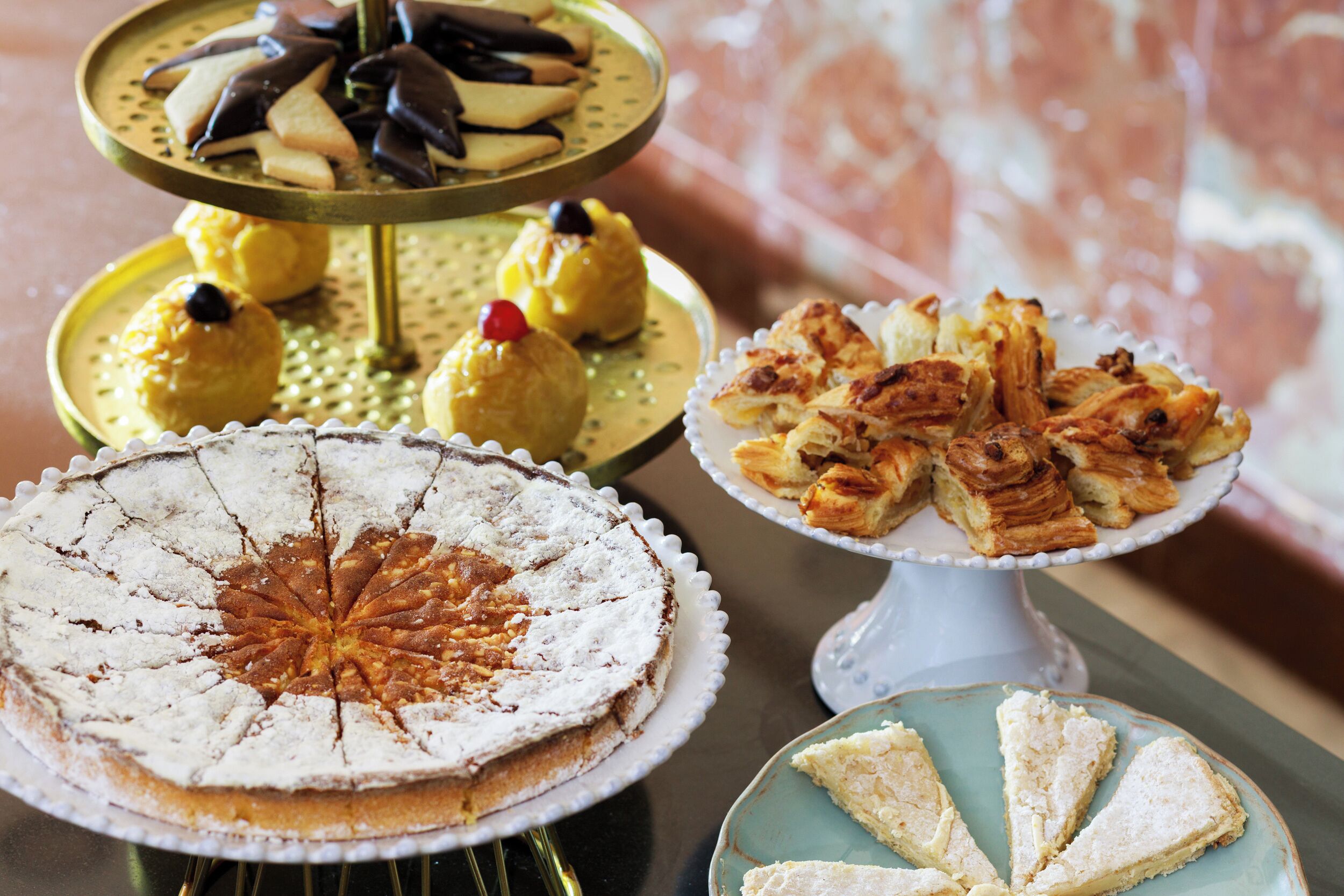 A variety of desserts on tiered stands.