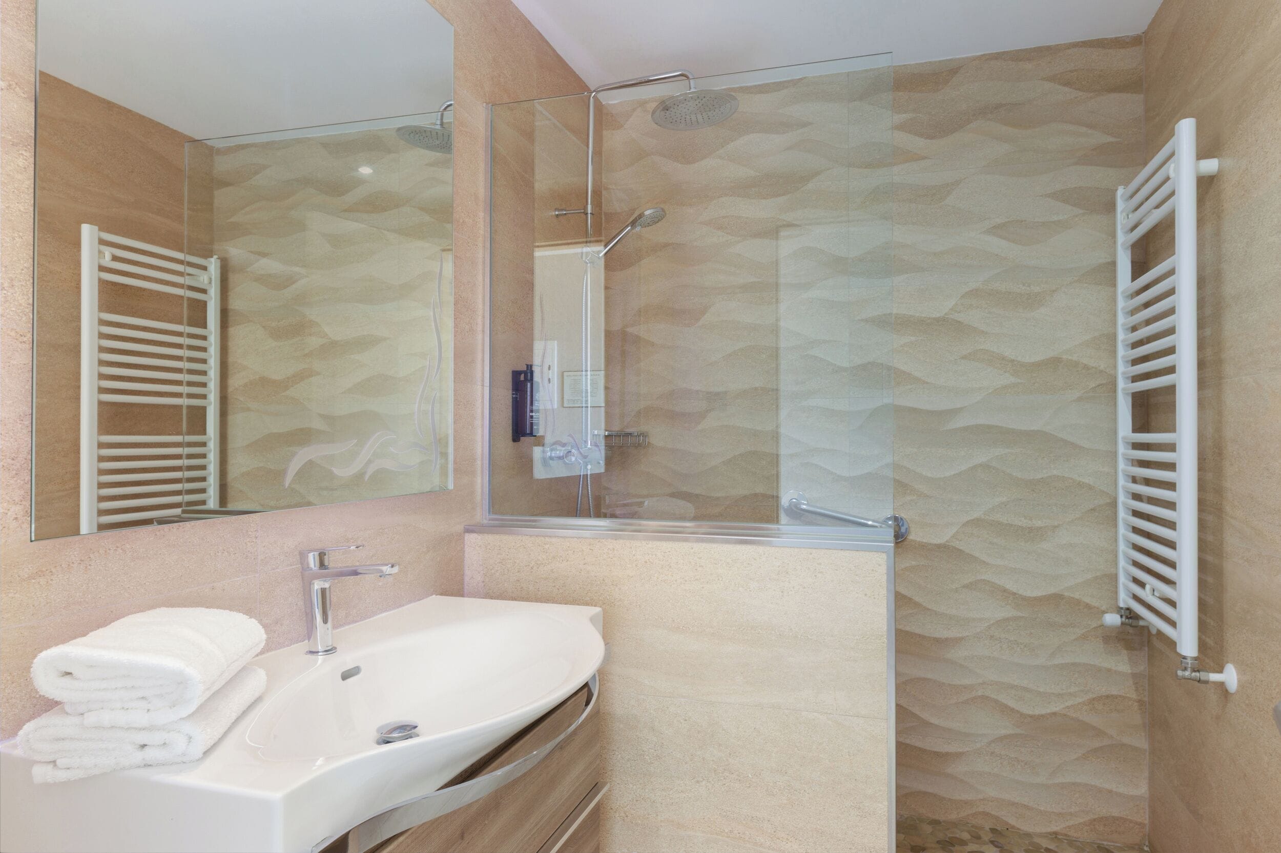 rainfall showerhead, eco-friendly toiletries, hair dryer, towels