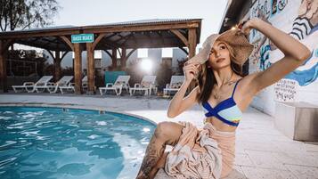 Outdoor pool, a heated pool, open 8:00 AM to 11:00 PM, free pool cabanas