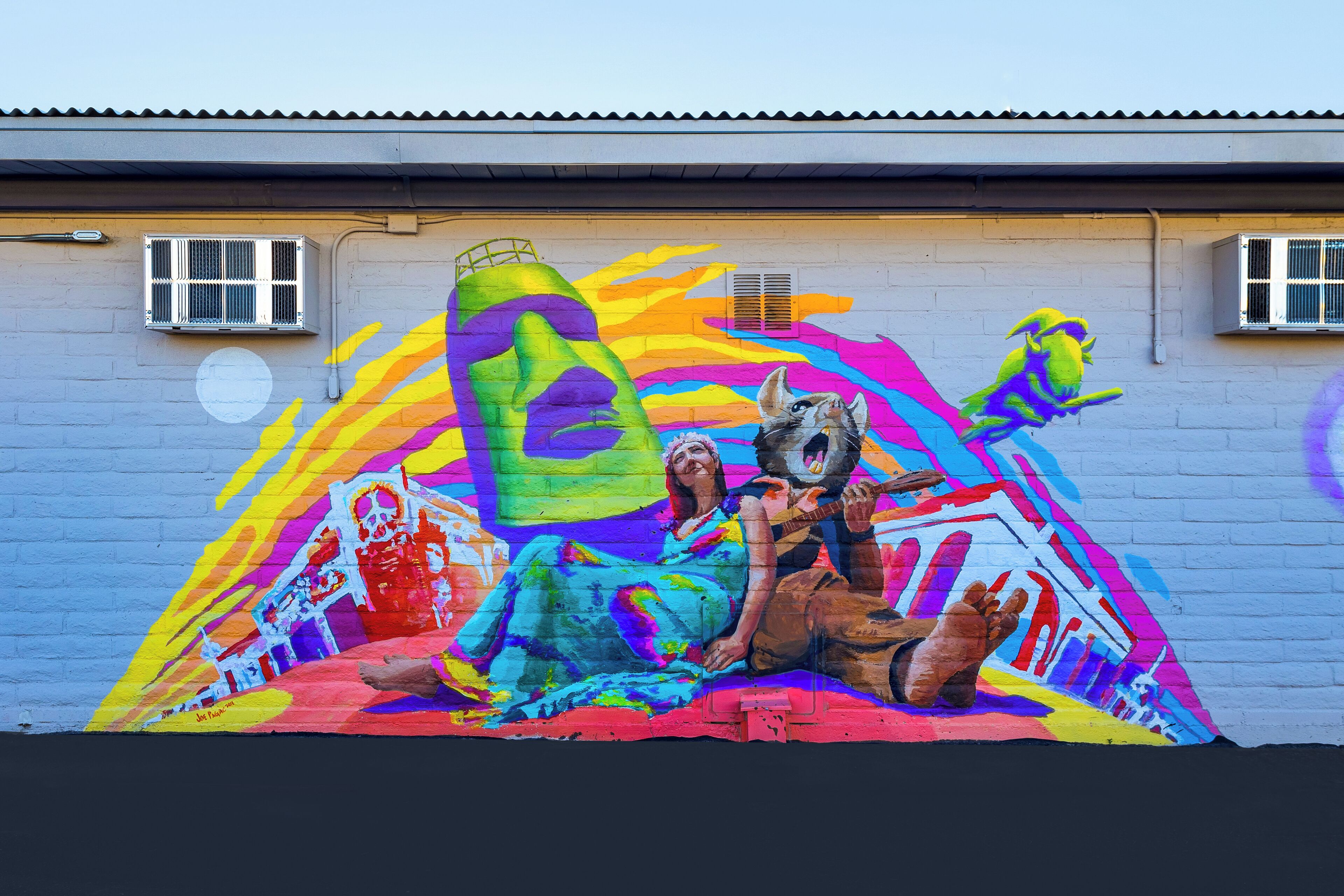 A colorful mural on a building wall.
