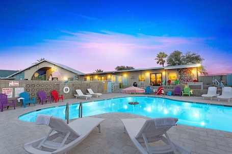 Outdoor pool, a heated pool, open 8:00 AM to 11:00 PM, free cabanas. Hotel McCoy Tucson - Art, Coffee, Beer, Wine