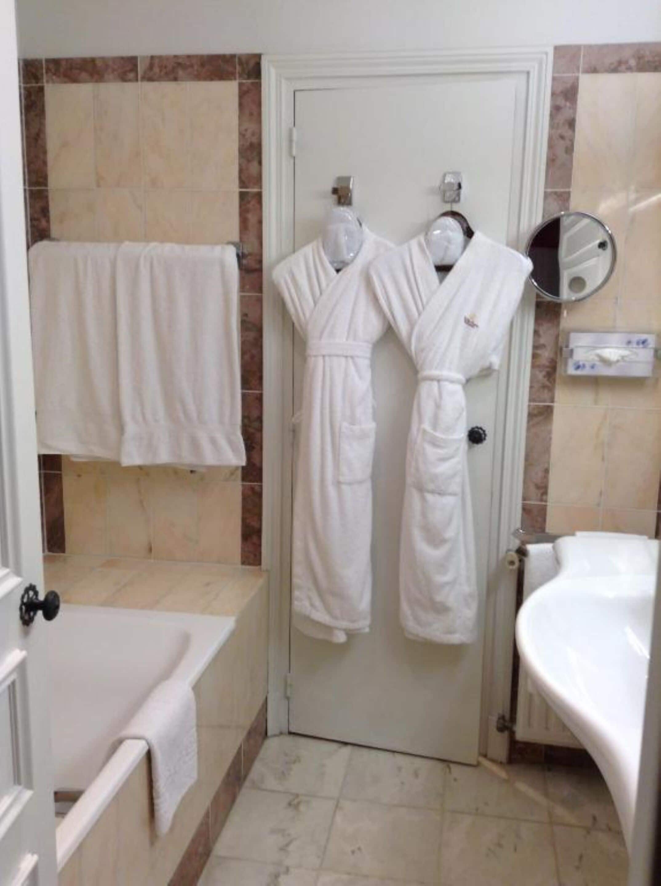 combined shower/bathtub, hair dryer, bathrobes, towels