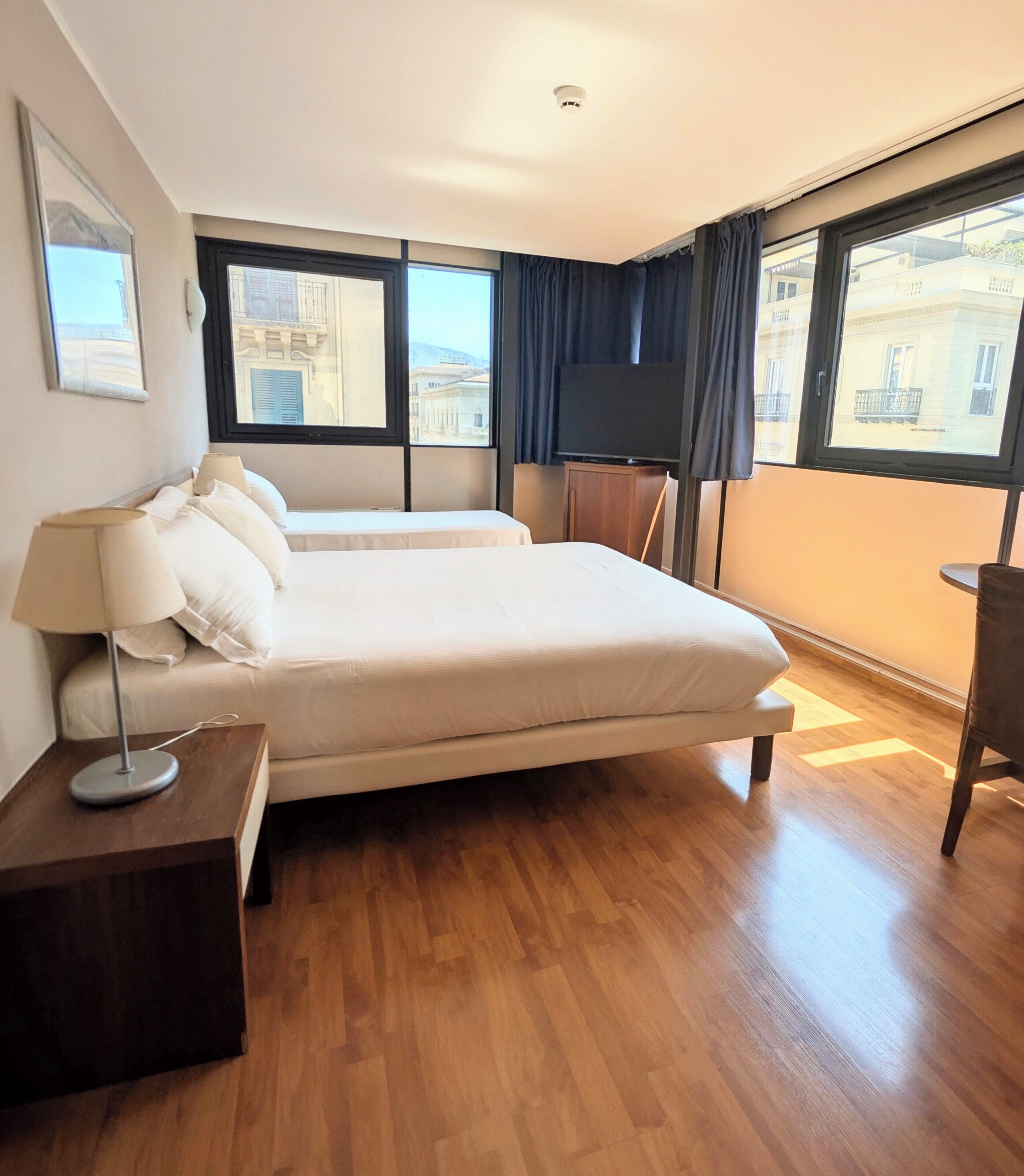 Quadruple Room | Minibar, in-room safe, blackout drapes, soundproofing