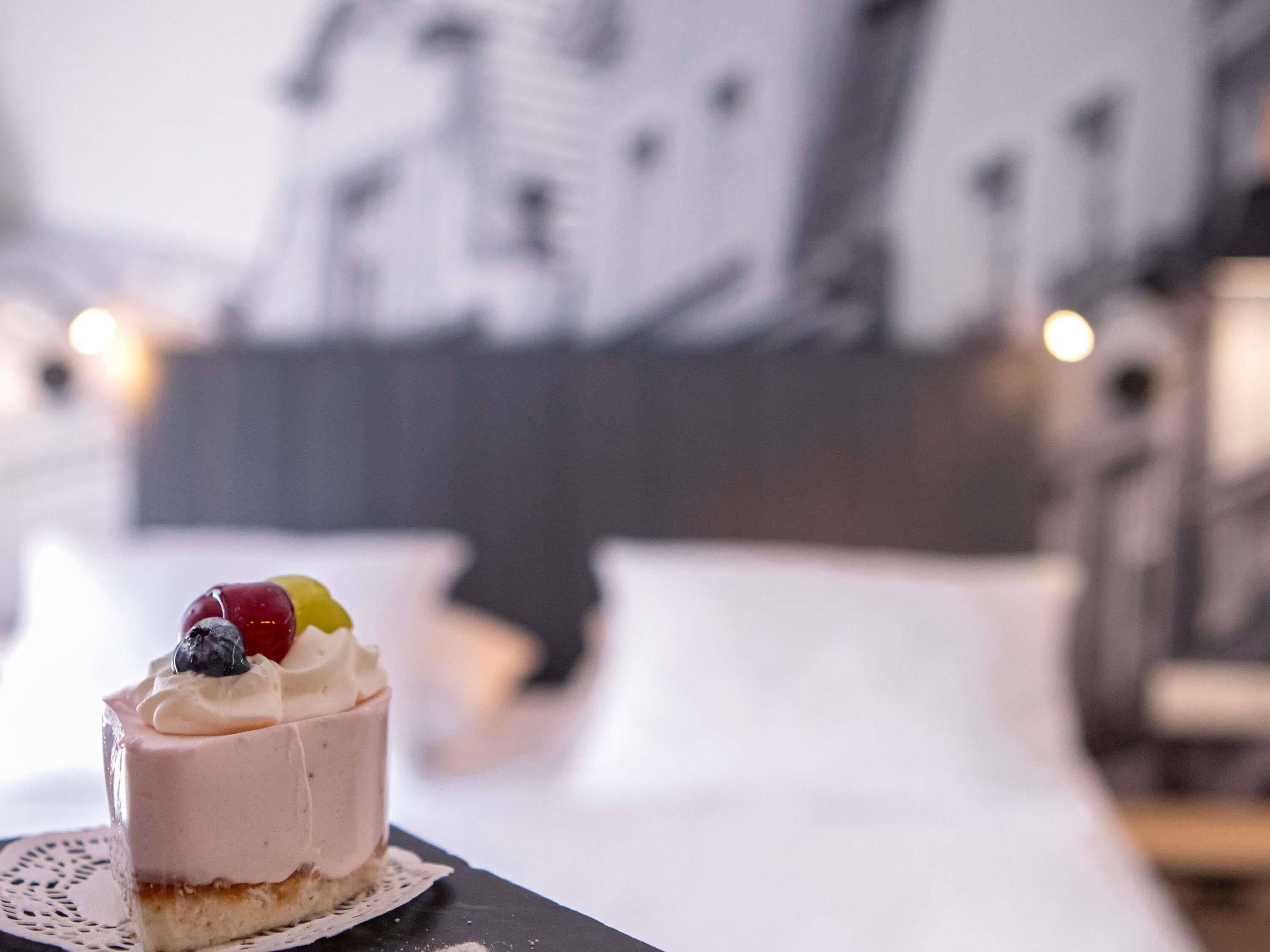 A dessert on a table with a blurred background of a room.