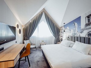 Hypo-allergenic bedding, desk, laptop workspace, blackout curtains