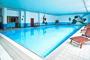 Indoor pool, open 7:00 AM to noon, pool loungers