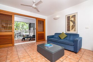 Suite, 2 Bedrooms, Pool View | Living area | 32-inch LCD TV with digital channels, TV, streaming services