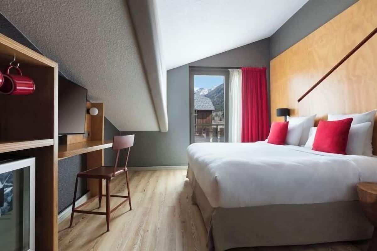 Luxe beddengoed, een minibar, een kluis op de kamer, een bureau