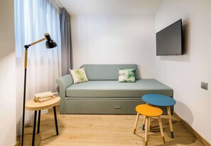 Family Room | Minibar, in-room safe, individually decorated, individually furnished