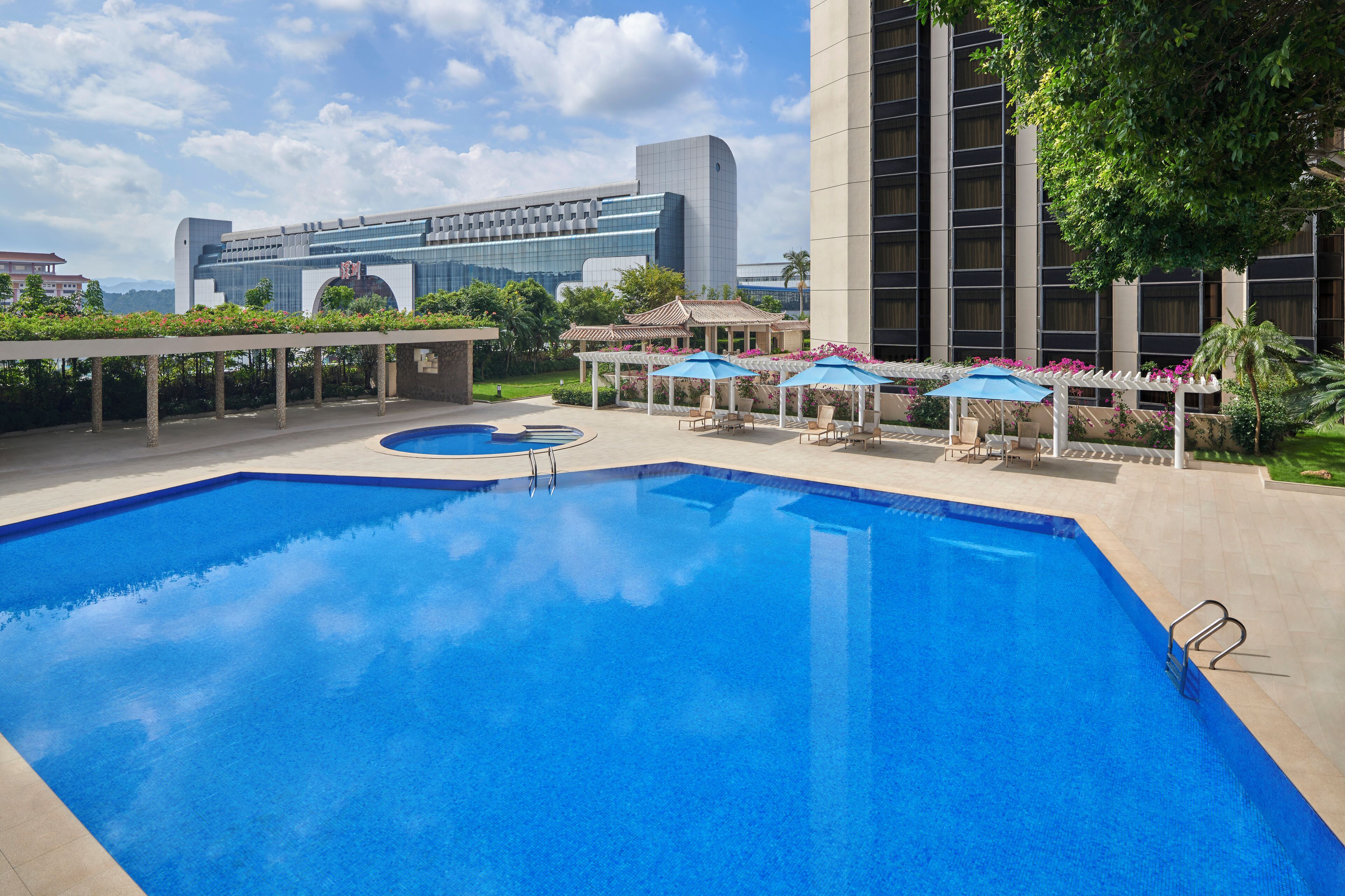 outdoor pool, pool umbrellas, pool loungers