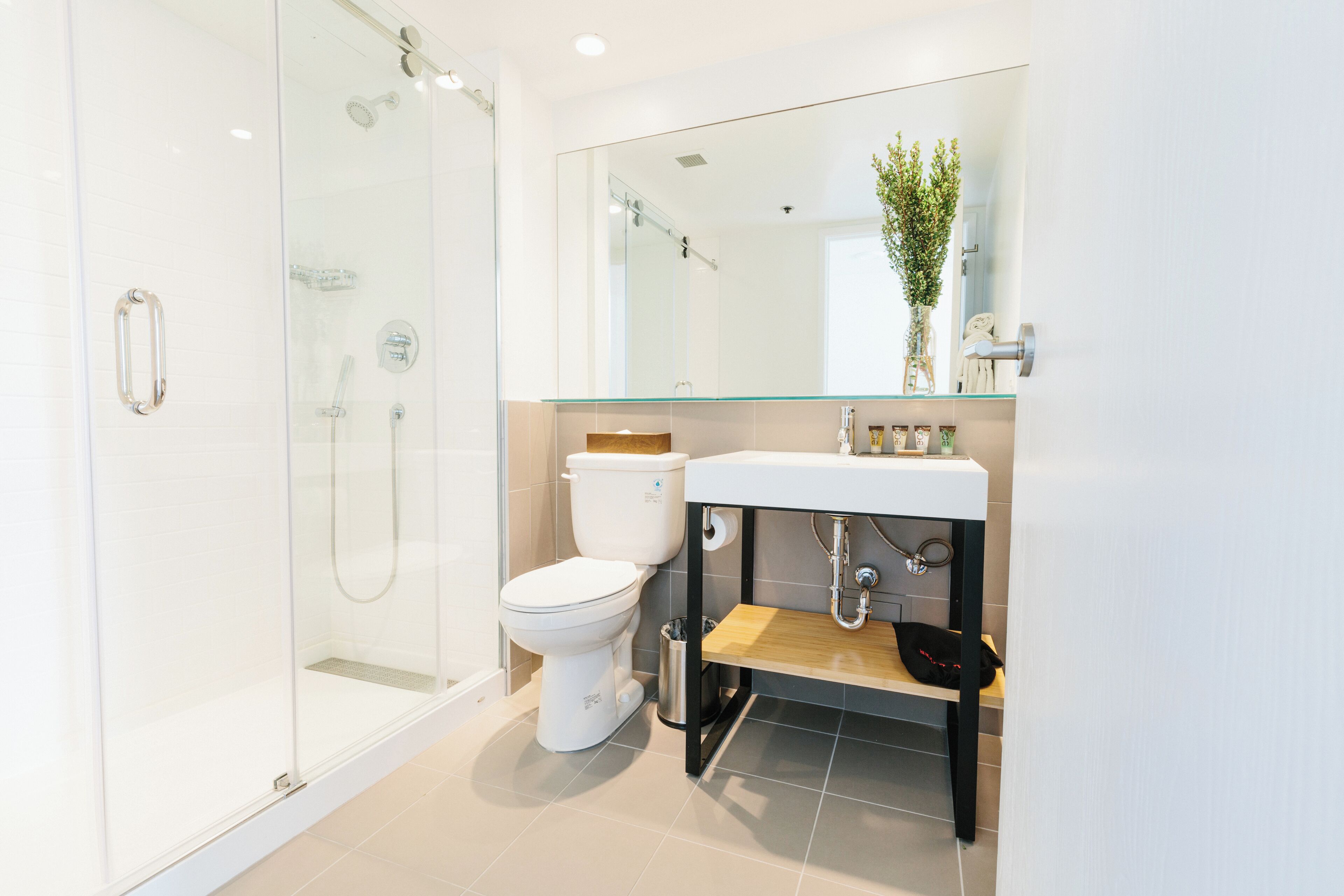 shower, eco-friendly toiletries, hair dryer, towels