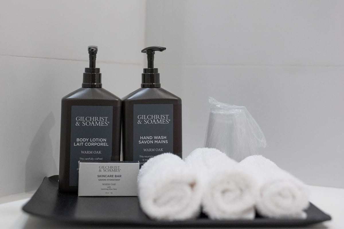 designer toiletries, hair dryer, towels, soap