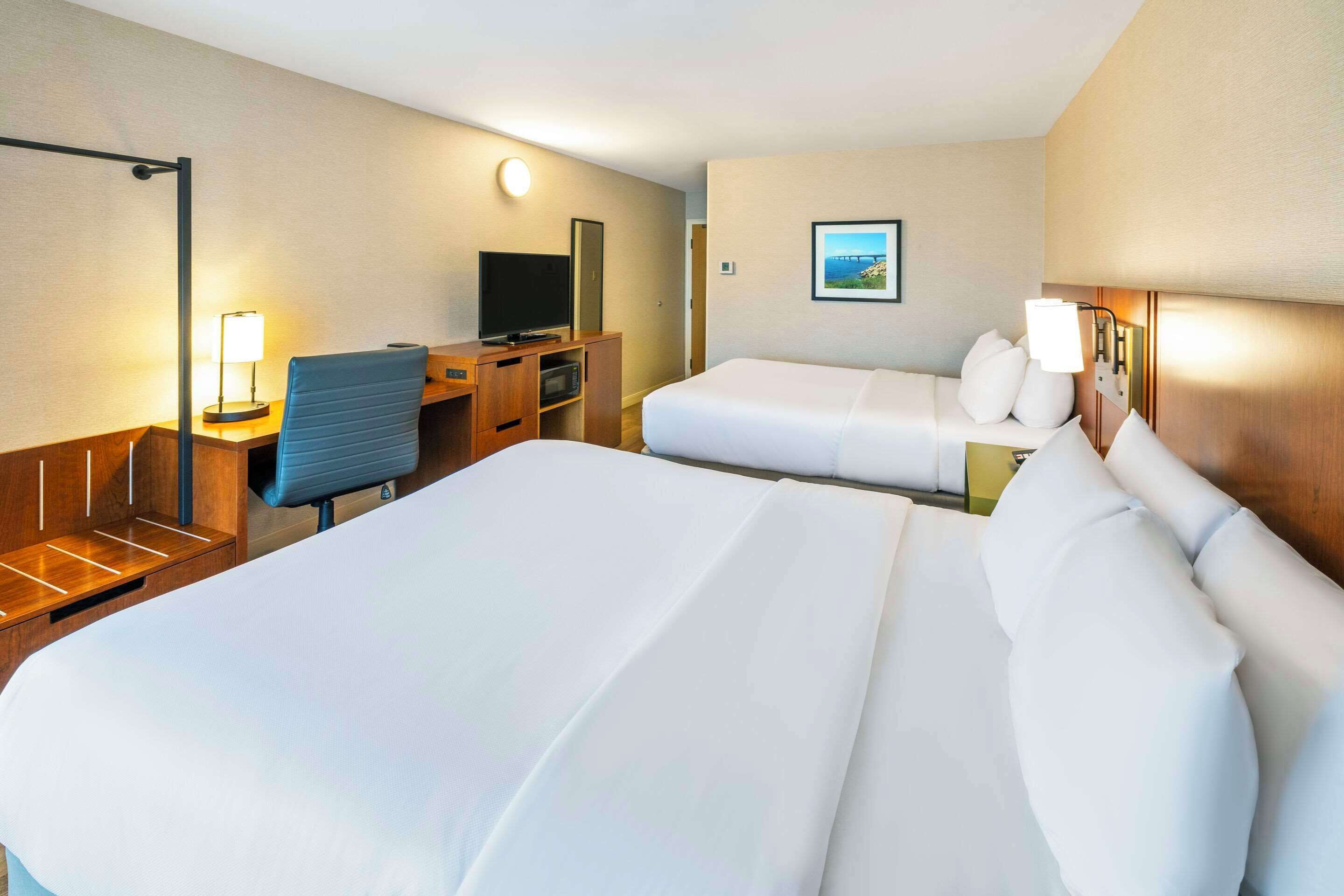 premium bedding, pillow-top beds, desk, blackout curtains