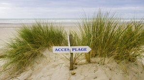 On the beach, sun-loungers, beach umbrellas, beach towels