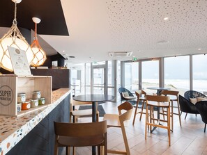 Lunch, dinner served; French cuisine, beach views 