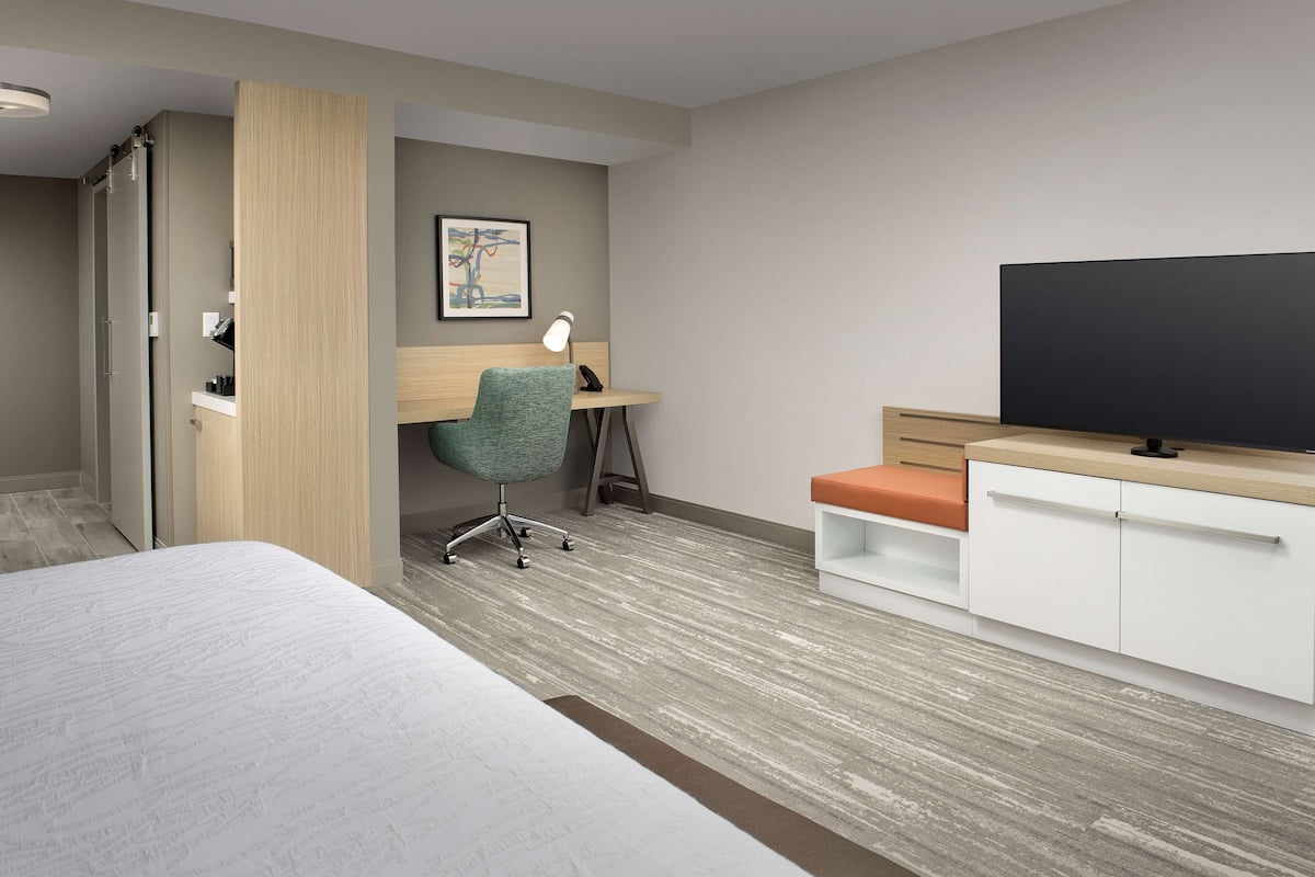 Chambre Deluxe, 1 trĂšs grand lit | Coffres-forts dans les chambres, bureau