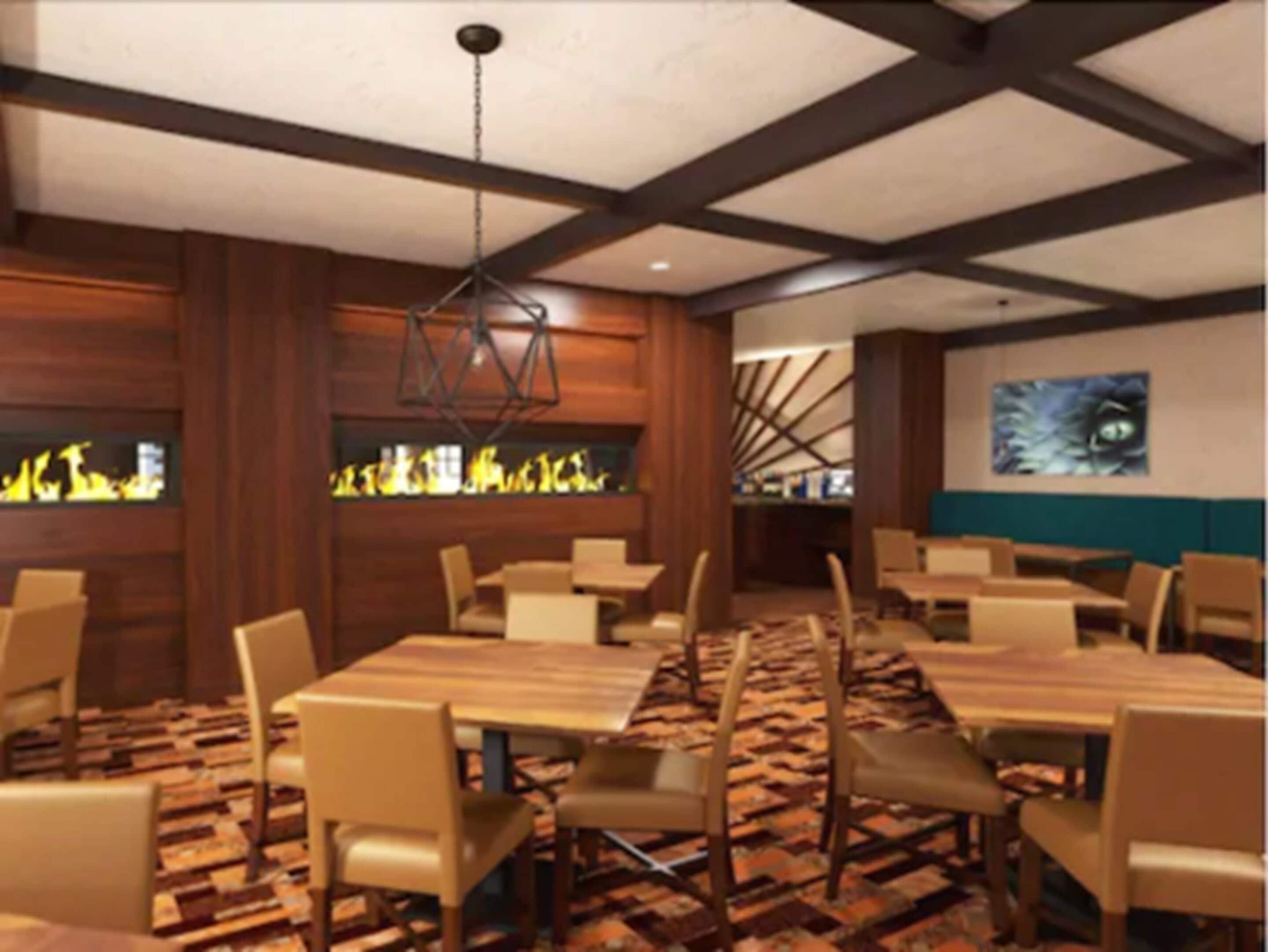 A restaurant with wooden walls, a patterned carpet, and a ceiling with exposed beams.