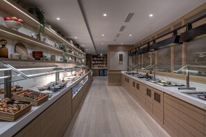 A modern breakfast buffet with a variety of food options and a clean, contemporary design. - Hilton Geneva Hotel and Conference Centre (Le Grand-Saconnex)