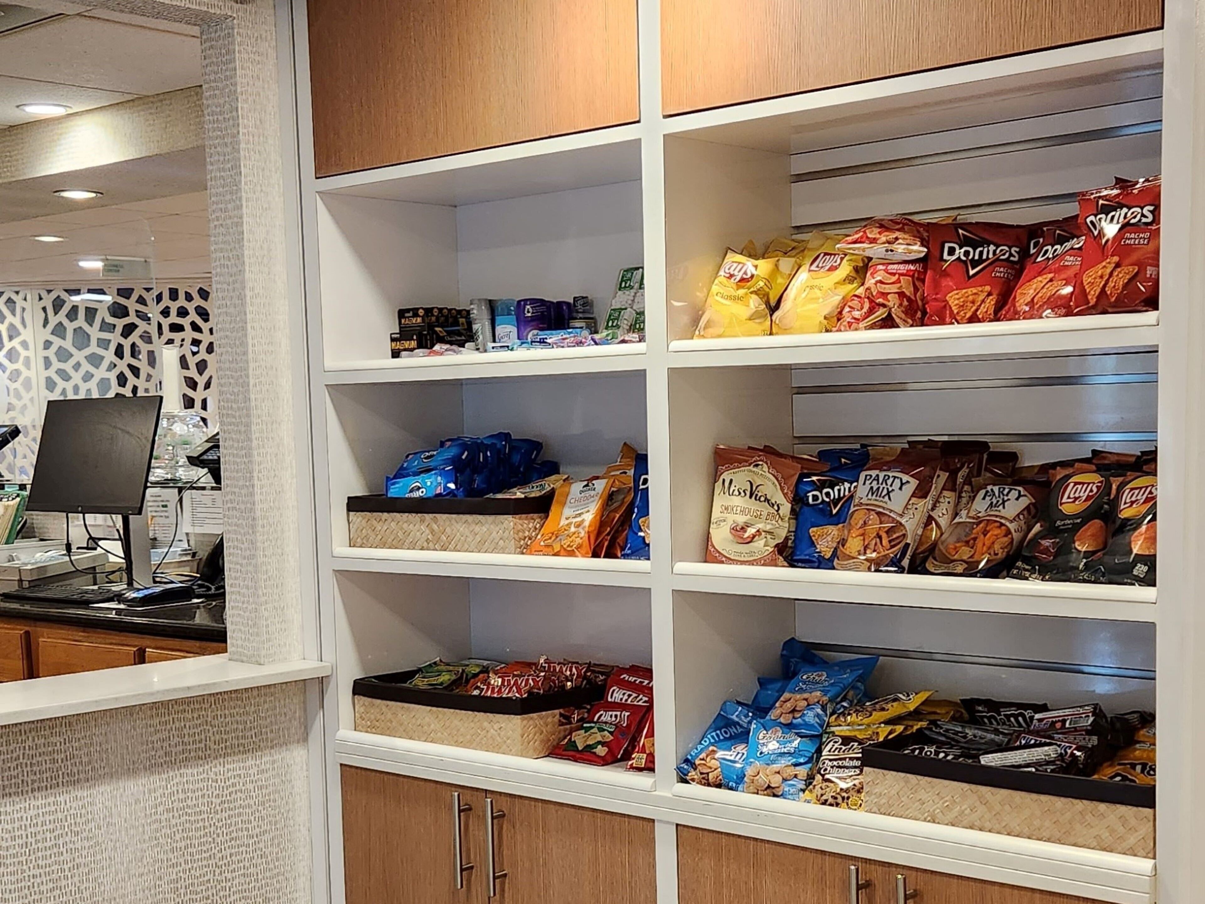 A snack display with various chips and snacks.