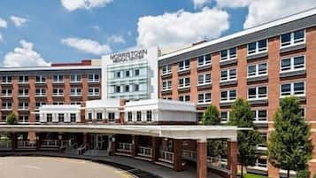 A multi-story building with a prominent sign reading "MORRISTOWN MEDICAL CENTER".
