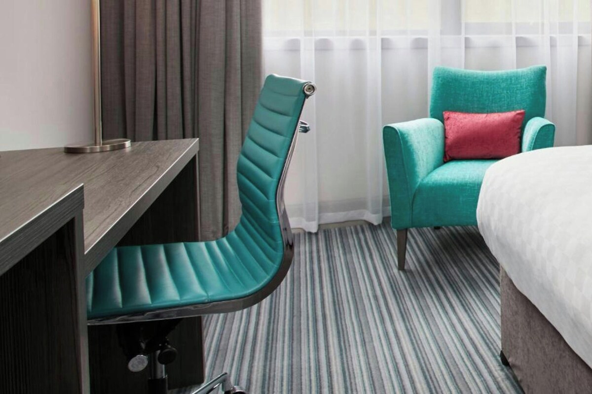 Premium bedding, desk, laptop workspace, soundproofing