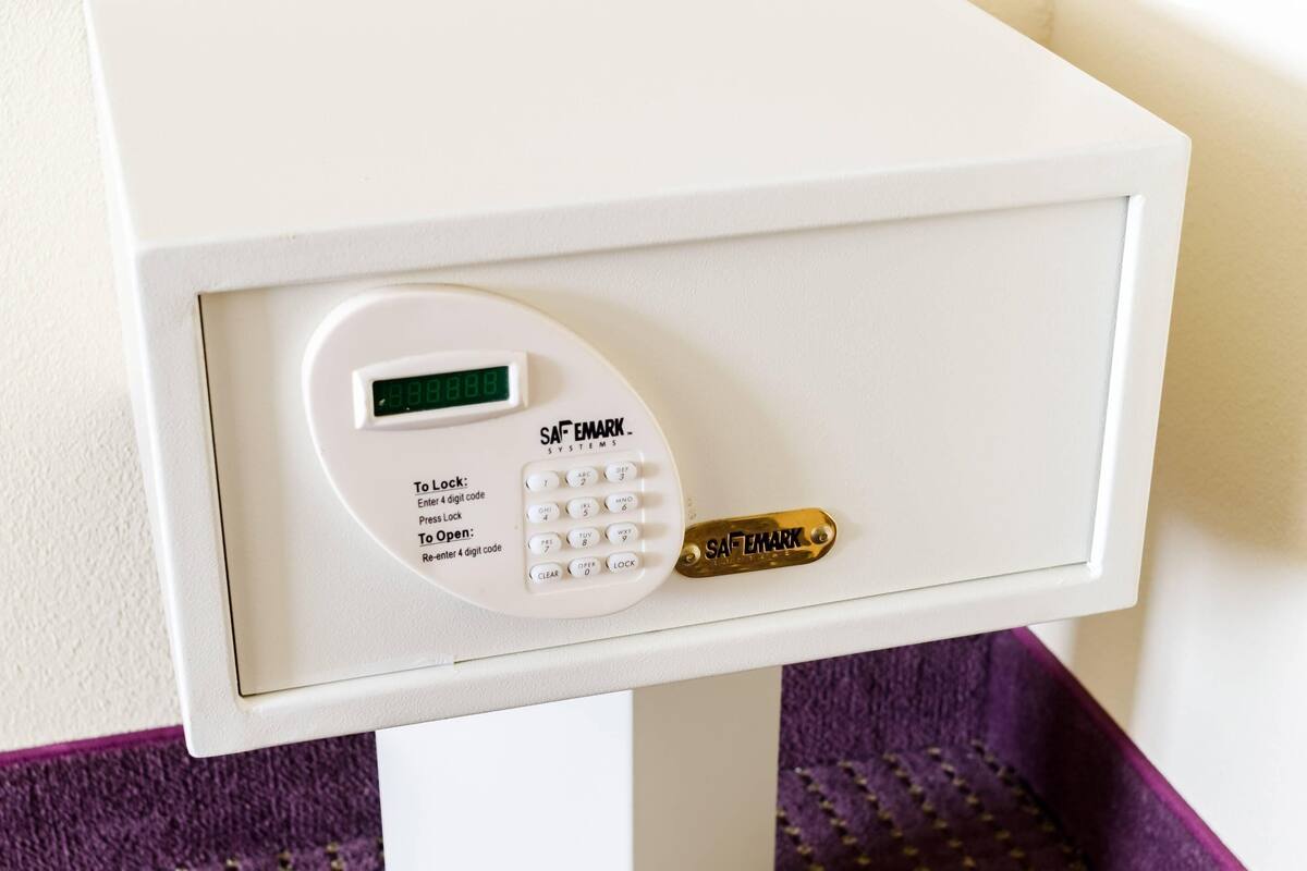 A digital lock with a keypad and a card reader for a room.