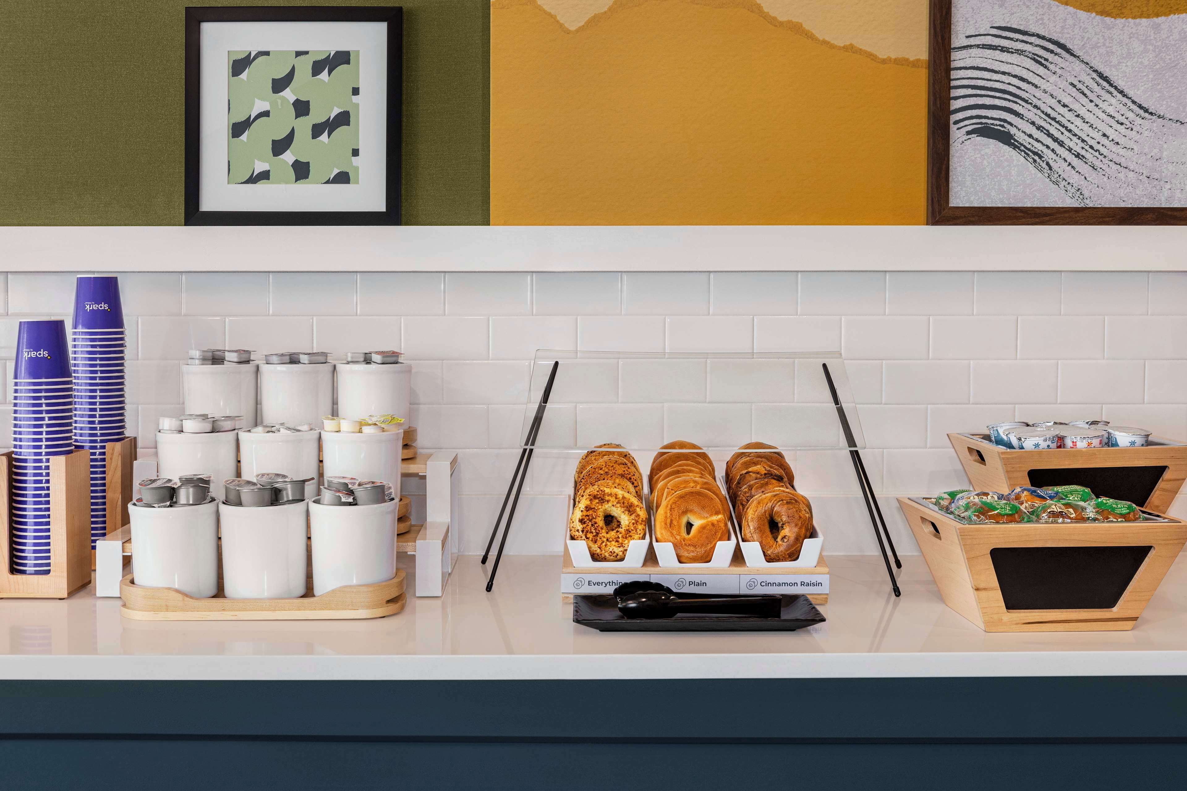 A breakfast bar with various food items and containers.