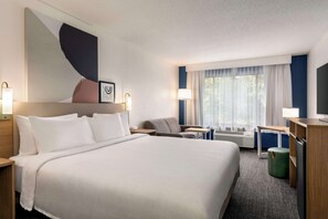 Premium bedding, pillow-top beds, desk, laptop workspace