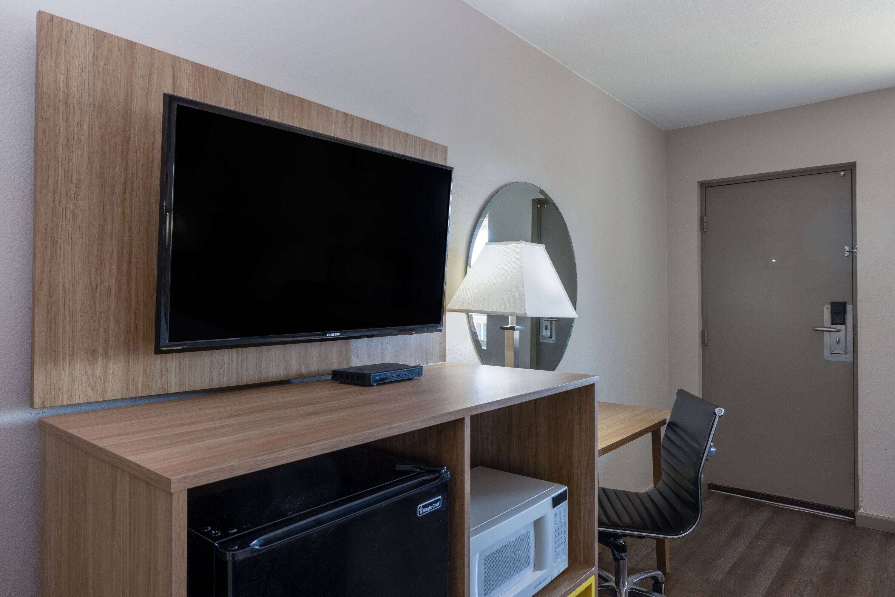 Desk, laptop workspace, blackout curtains, iron/ironing board