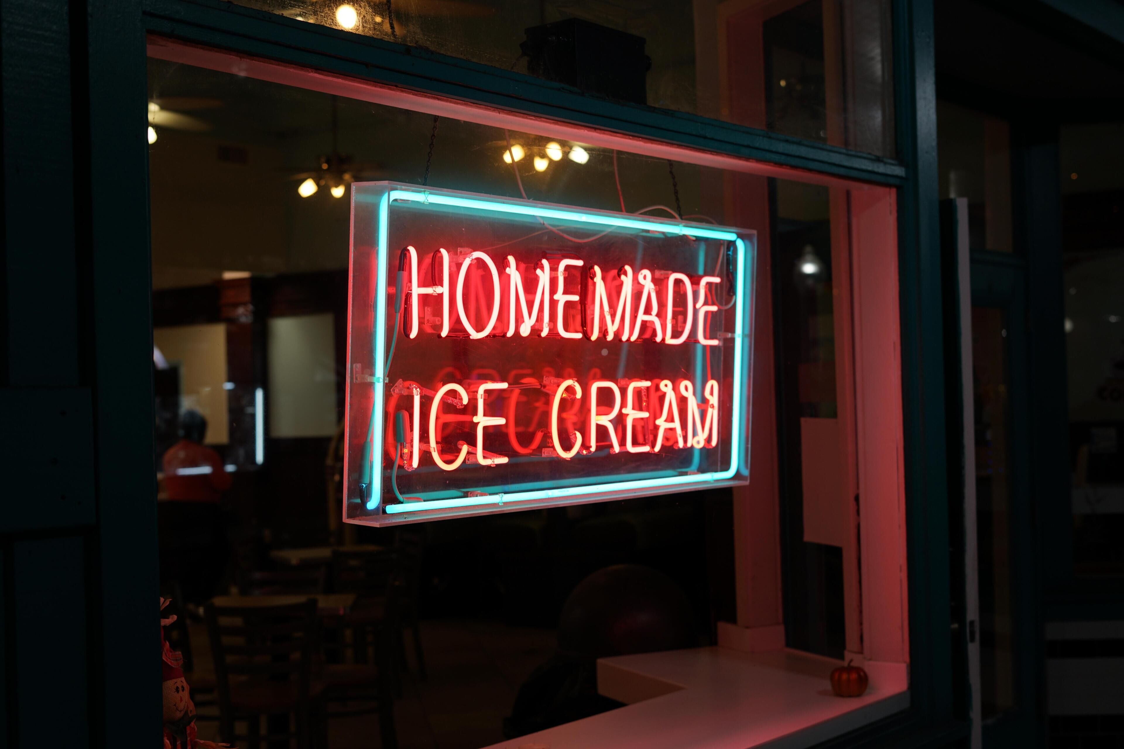 A neon sign advertising homemade ice cream.