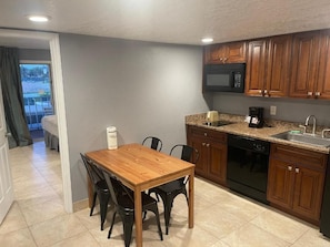 Superior Suite, 2 Double Beds and 1 Murphy Bed, Pool View | Private kitchen | Coffee/tea maker, fridge, microwave, stovetop - Celebration Suites (Kissimmee)