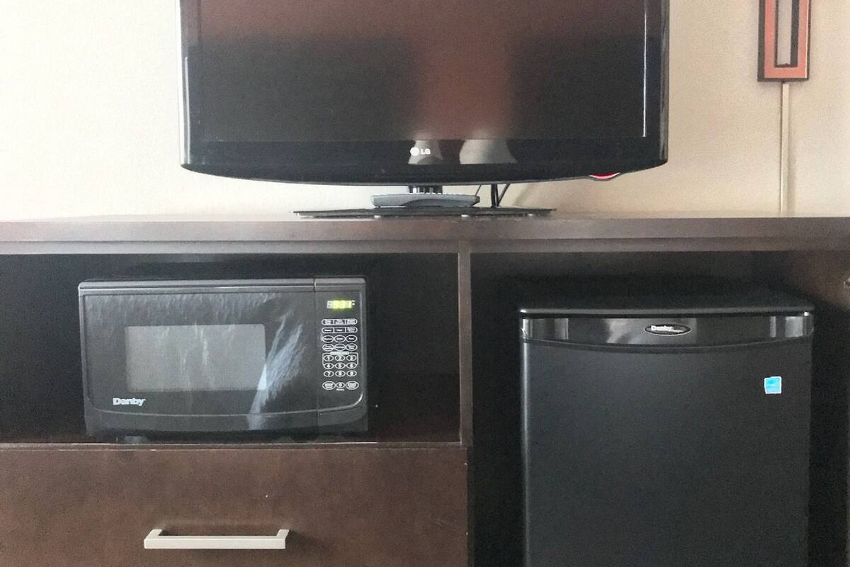 premium bedding, pillow-top beds, desk, laptop workspace