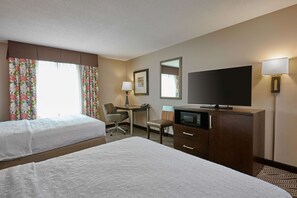 Premium bedding, pillow-top beds, desk, laptop workspace