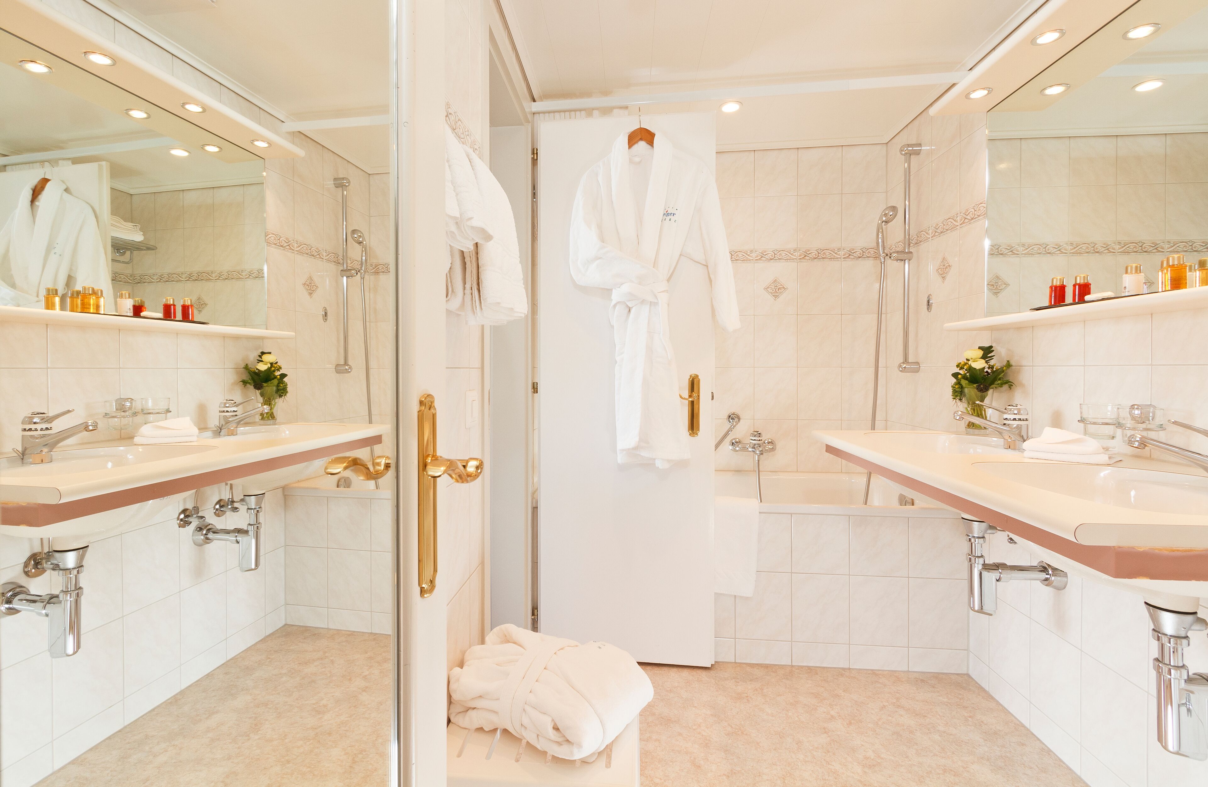 double room with eiger mountain view | bathroom | hair dryer, bathrobes, slippers, towels