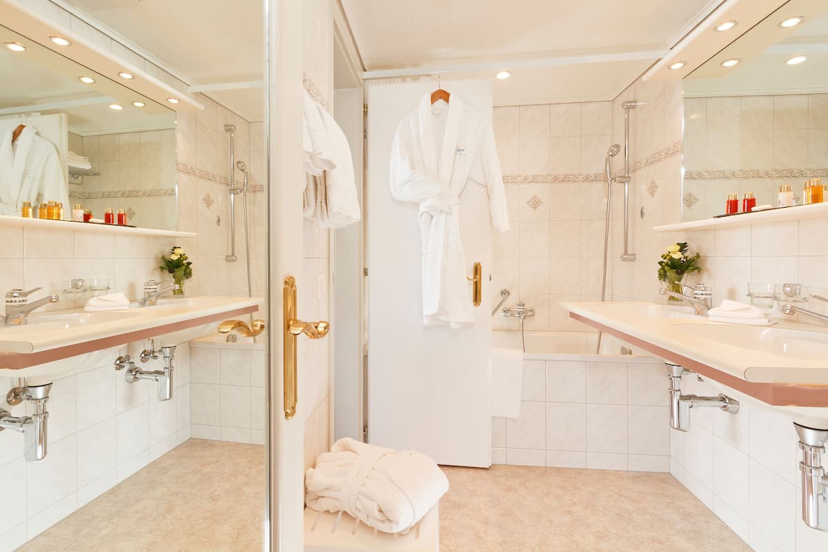 double room with eiger mountain view | bathroom | hair dryer, bathrobes, slippers, towels