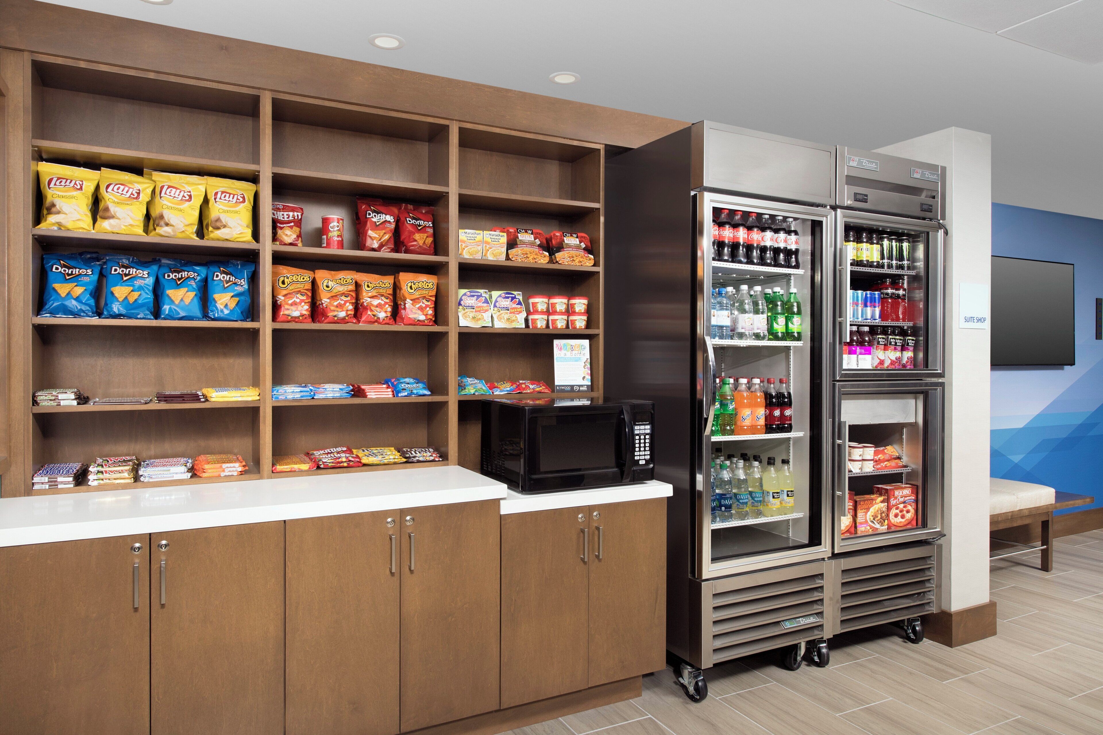 A snack and beverage vending area with various snack options and drinks.