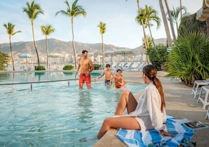 2 outdoor pools, open 8:00 AM to 8:00 PM, pool loungers