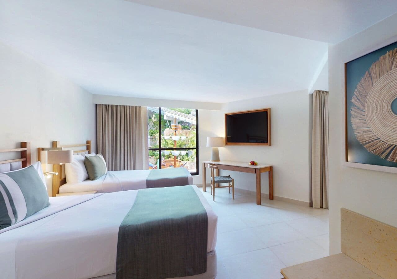 Deluxe Room, Pool View | In-room safe, desk, blackout drapes, iron/ironing board