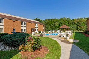 Seasonal outdoor pool, open 11:00 AM to 8:00 PM, pool umbrellas