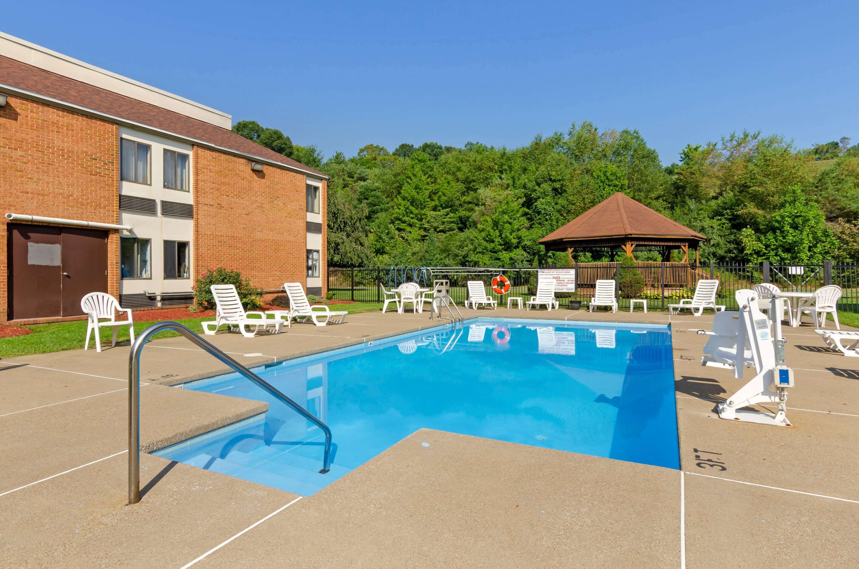seasonal outdoor pool, open 11:00 am to 8:00 pm, pool umbrellas
