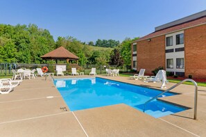 Seasonal outdoor pool, open 11:00 AM to 8:00 PM, pool umbrellas