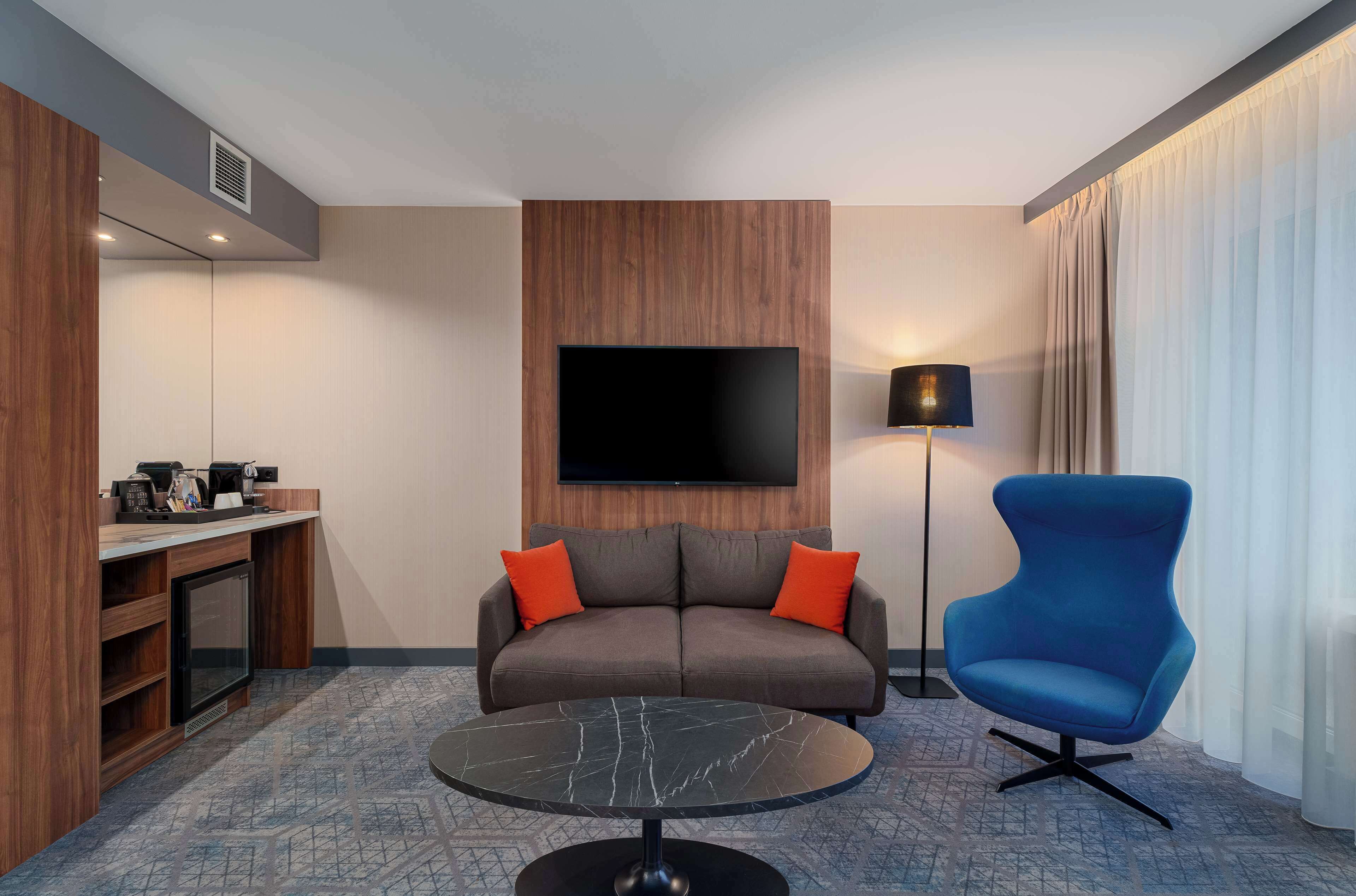junior suite | in-room safe, desk, laptop workspace, iron/ironing board