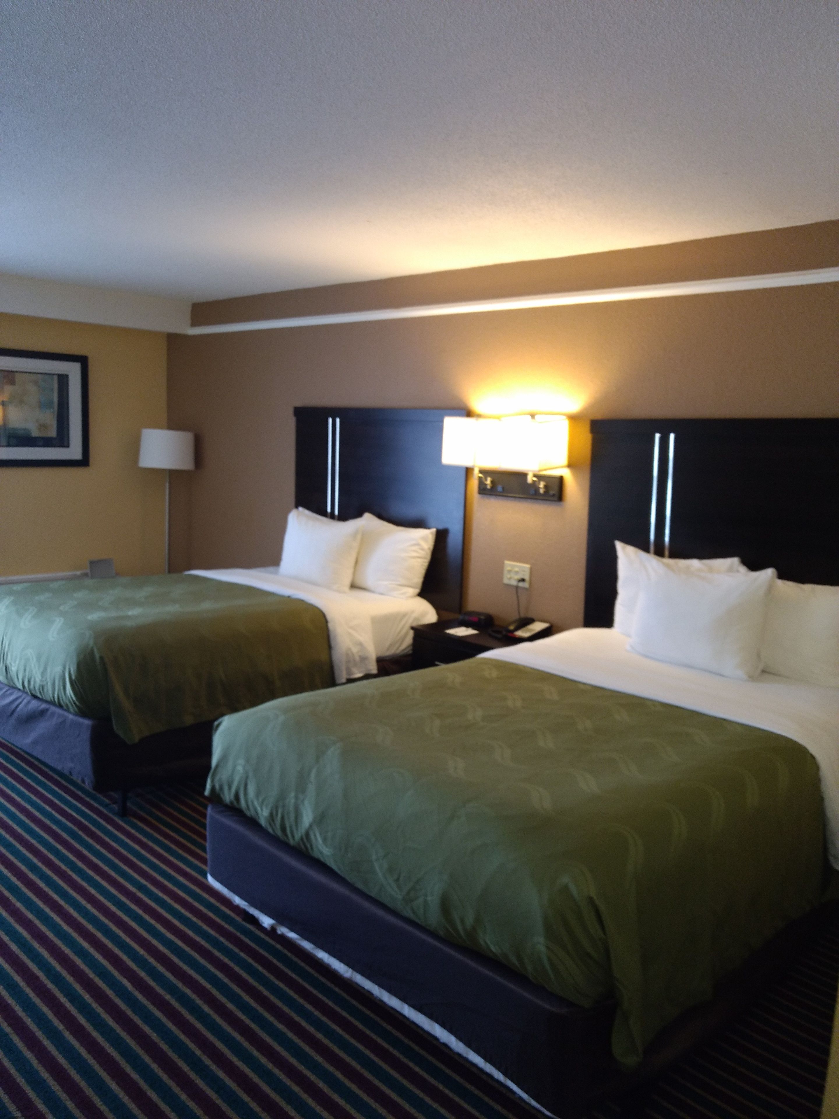 Desk, laptop workspace, blackout drapes, iron/ironing board