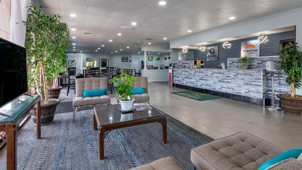 A spacious lobby with a reception desk, seating area, and a television. - Quality Inn Rock Hill Northeast I-77 (Rock Hill)