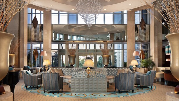 A spacious lobby with a grand chandelier, comfortable seating, and large windows offering views of the city. - Sheraton Ankara Hotel & Convention Center (Ankara)