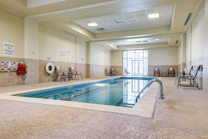 An indoor swimming pool with a tiled floor, a lifeguard chair, and a sign indicating no diving allowed. - Holiday Inn Indianapolis Carmel by IHG (Indianapolis)