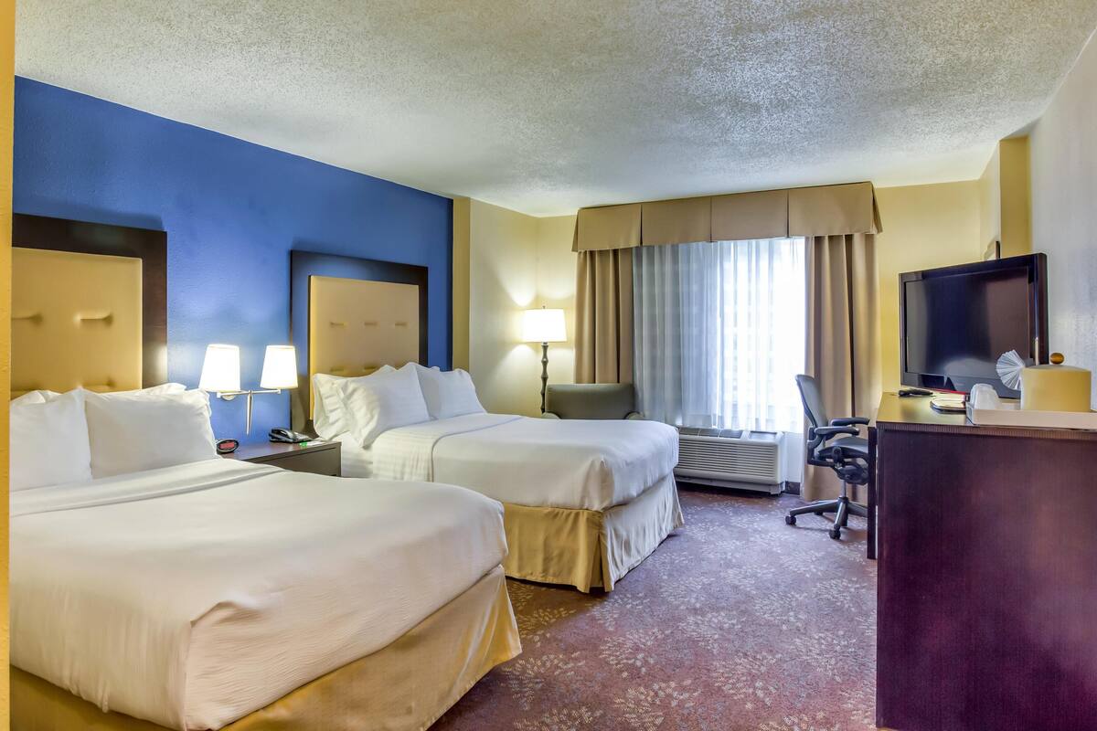 Premium bedding, pillow-top beds, desk, laptop workspace
