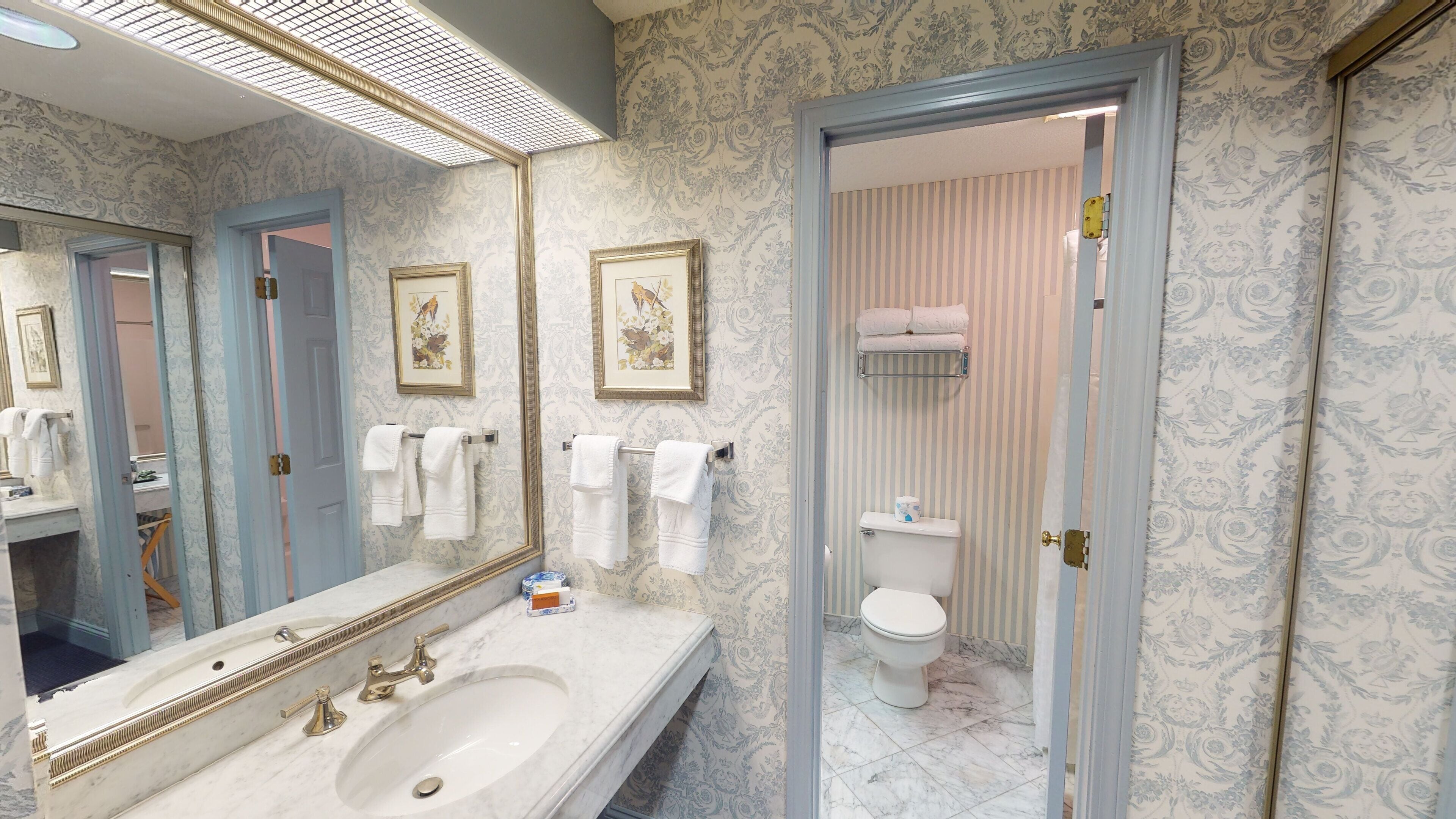 deluxe room, 1 king bed | bathroom | combined shower/bathtub, designer toiletries, hair dryer, towels