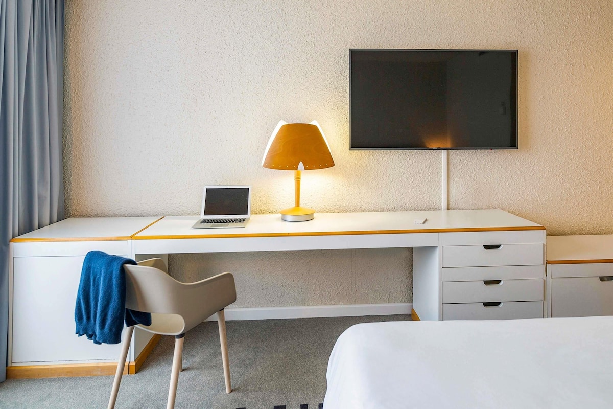 Premium bedding, free minibar items, desk, blackout curtains