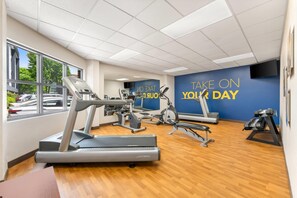 A gym with treadmills, elliptical machines, and a wall with motivational text. - Comfort Suites Bethlehem Near Lehigh University and LVI Airport (Bethlehem)